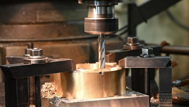 High resolution the plunge milling process the brass ring part on NC milling machine.