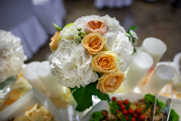 Bouquet of flowers in vase on the wedding table