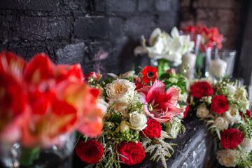Row of bright wedding flowers on a shelf