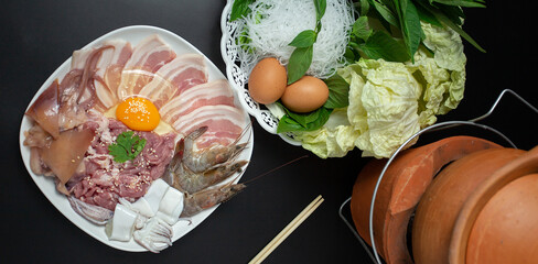 Sliced raw pork, fresh chicken eggs and fresh vegetables, Isaan Thai food ''chim chum'' is a famous...