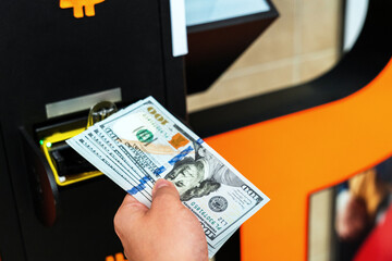 Atm cash bitcoin teller machine. Woman withdraw american dollar bill money. Usd hundred money...