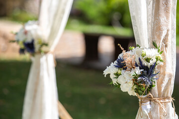 Flowers on the arch for the wedding ceremony