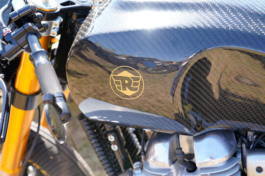 Royal Enfield carbon logo brand and text sign on Indian motorbike fuel tank of vintage re motorcycle