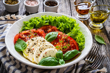 Caprese salad on wooden board

