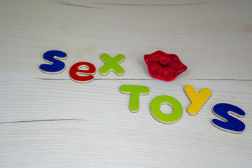sex toys phrase words from letters, concept of advertisement for sex shop or blog 