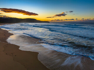 Aerial sunrise at the beach with clouds