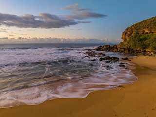 Aerial sunrise at the beach with clouds