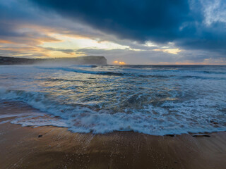 Sunrise at the seaside with large and powerful sets