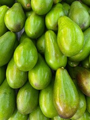 Close-photo of avocado in a fruit market.