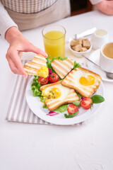 Heart shaped Fried Egg on Toast Bread and cup of fresh hot espresso coffee