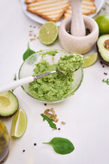 Toasts preparation - Mashed avocados in a glass bowl