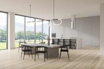 Stylish kitchen interior with eating table, bar countertop and panoramic window