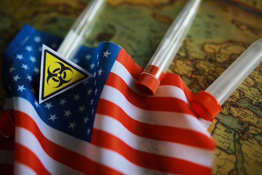 American flag and biohazard sign. The concept of American biolabs and research centers.