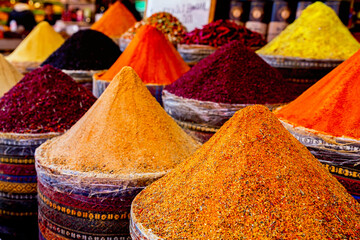 Spices Market with colourful mood. Multicolor spices sold at Egypt Bazaar (Misir Carsisi) in Istanbul, Turkey (Turkiye). Selected focus, copy space, colorful background - obrazy, fototapety, plakaty