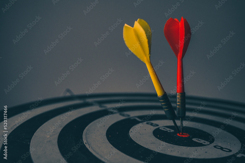 Aufkleber close up shot of the dart arrow hit on bulleyes of dartboard to represent that the business reached 