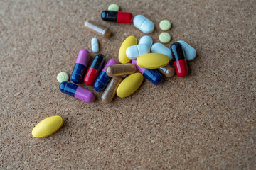 Pharmaceutical medicine pills in both tablets and capsules with the vintage retro picture style. Pharmacy theme and treatment medication as concept.