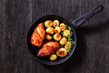 grilled chicken breasts with browned new potatoes