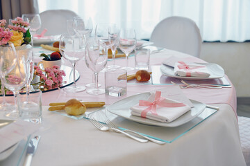 Detail of a table set in pink for a wedding banquet