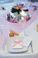 Detail of a table set in pink for a wedding banquet