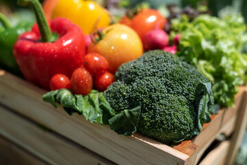 wooden box full of fresh vegetables.