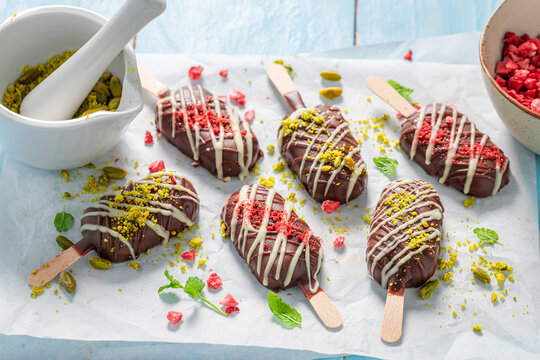 Sweet and chocolate popsicles made of dark and white chocolate.