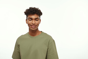 Smiling black good-looking guy with closed eyes