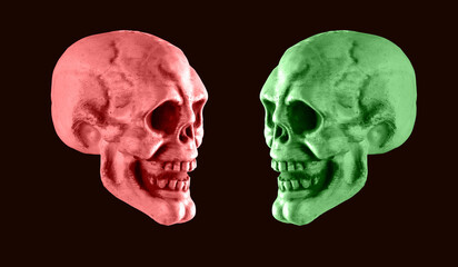 Pink and green skulls on black background. Halloween holiday or human duality concept. Contrast...