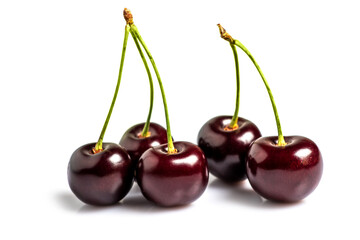 Fresh black sweet cherry fruit on white background.