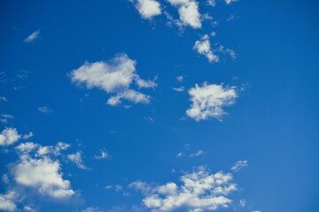 Naklejka na ściany i meble White Clouds Scattered in Blue Sky