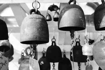 Thai temple bells and monks Lotus flower on Sunny day, Tradition Asian bells in front of the famous marble temple in Buddhist temple in Bangkok, Thailand, close up small Thai style bell in the temple
