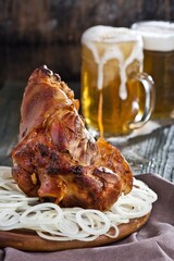 Pork knuckle with beer, food photography.