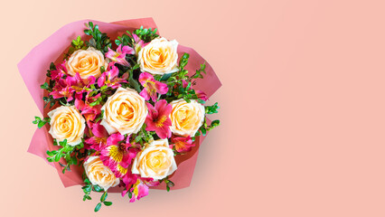 Bouquet of beautiful roses and alstroemeria on pink background. Fresh, lush bouquet of colorful flowers for wedding, valenitnes day, mother day. Floral shop concept, top view, flat lay, copy space