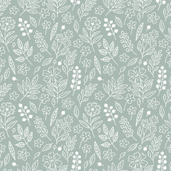 Seamless floral pattern with white berries, leaves and flowers on a blue-gray background in doodle style. Delicate, boho floral texture for fabrics, textiles, wallpaper, paper.