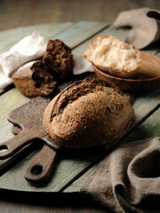 Dark rye bread on the table, food photography.