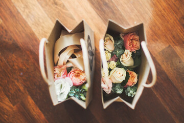Wedding flowers in packages on a wooden floor