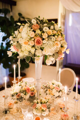 Bouquet of flowers in vase on the wedding table