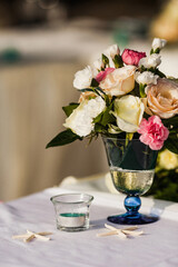 Bouquet of flowers in vase on the wedding table