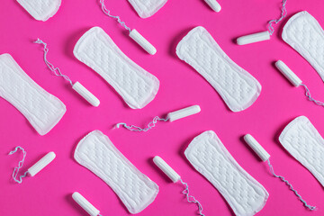 Tampons, feminine sanitary pads pattern on pink background. Hygiene care during critical days. Menstrual cycle.
