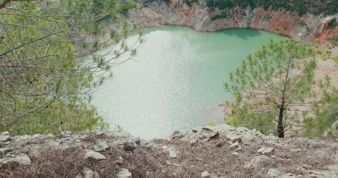 Small artificial lake created in a former quarry in Modugno, near Bari. Nature has created a wild but pleasant environment.