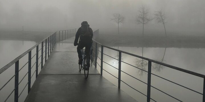 Cycling in the fog in the morning