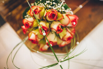 Colorful wedding bouquet on the wooden table