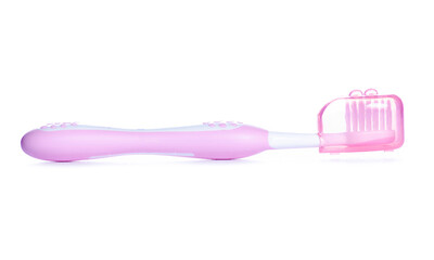 Children's pink toothbrush on white background isolation