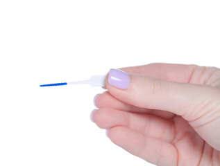 Interdental tooth brushes in hand on white background isolation