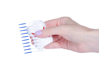 Interdental tooth brushes and dental floss in hand on white background isolation