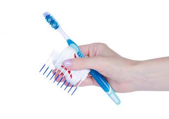 Interdental tooth brushes, toothbrush and dental floss in hand on white background isolation