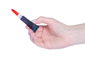 A tube of superglue in hand on white background isolation