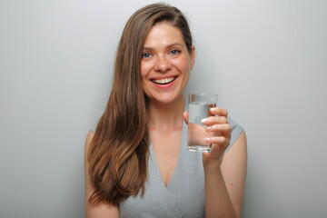 Smiling woman holding water glass isolated female portrait.