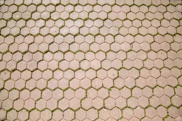 Hexagonal shaped artificial paving stone background on a clear sunny day, texture backgrounds for...