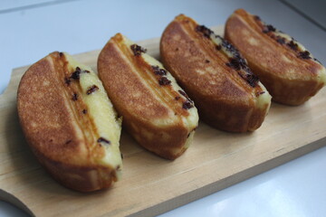 Pukis are traditional Indonesian cakes or snacks made from flour-based dough and cooked in a special molded frying pan. This is a snack commonly found in traditional Indonesian markets