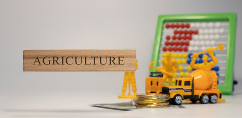 Agriculture sentence written on wooden surface. Economy and concept.